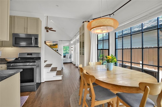 770 Barnett St NE, Atlanta, GA 30306 - dining space featuring healthy amount of natural light, dark wood-style floors, ceiling fan, stairway, and lofted ceiling