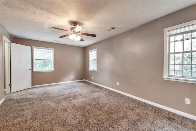 912 Third St, Stone Mountain, GA 30083 - carpeted spare room with a ceiling fan, baseboards, and a textured ceiling