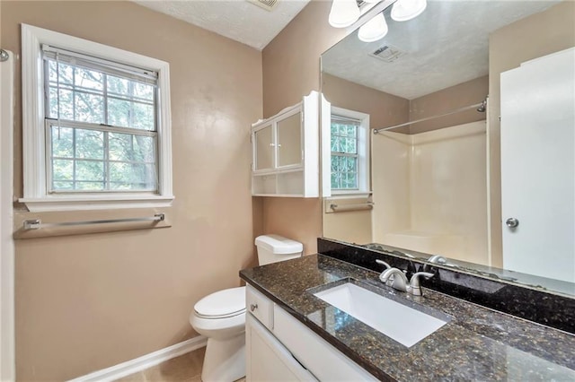912 Third St, Stone Mountain, GA 30083 - bathroom with a shower, toilet, vanity, baseboards, and tile patterned floors