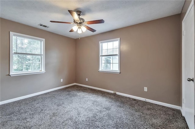 912 Third St, Stone Mountain, GA 30083 - spare room with ceiling fan, carpet floors, baseboards, and a textured ceiling