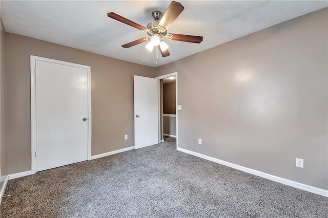 912 Third St, Stone Mountain, GA 30083 - unfurnished bedroom featuring carpet flooring, baseboards, and a ceiling fan