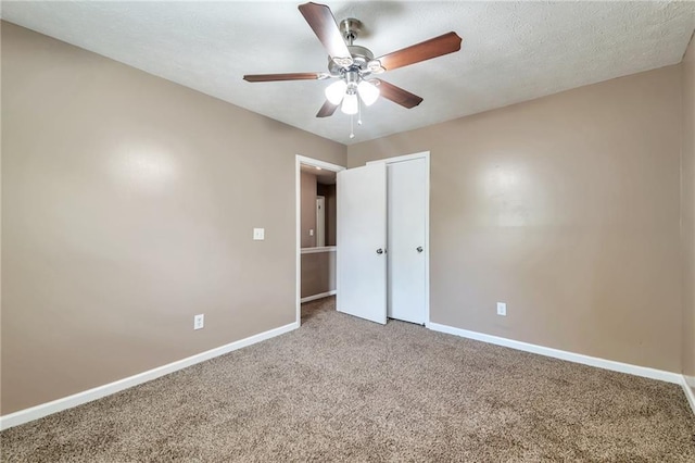 912 Third St, Stone Mountain, GA 30083 - unfurnished bedroom featuring baseboards, carpet flooring, a closet, and ceiling fan