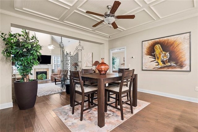 dining room with a wealth of natural light, coffered ceiling, and wood finished floors