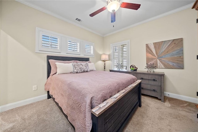 bedroom with visible vents, light colored carpet, baseboards, and ornamental molding