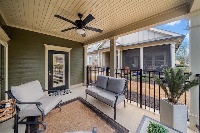 view of patio / terrace with an outdoor living space, a ceiling fan, and a sunroom