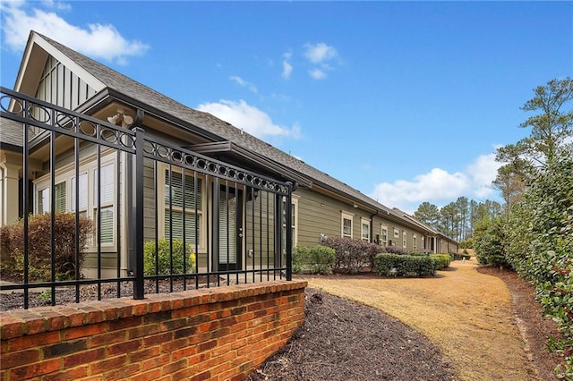 view of home's exterior featuring roof with shingles