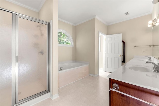 bathroom featuring vanity, ornamental molding, and separate shower and tub