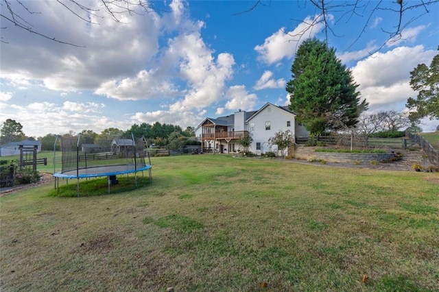 view of yard with a trampoline