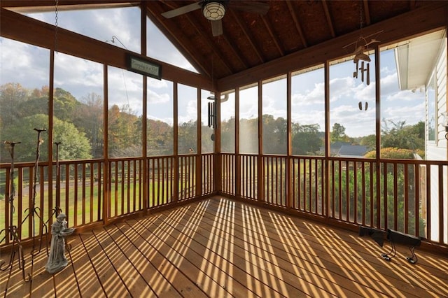 unfurnished sunroom with a wealth of natural light, ceiling fan, and vaulted ceiling