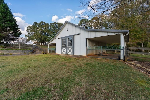 view of outdoor structure featuring a lawn