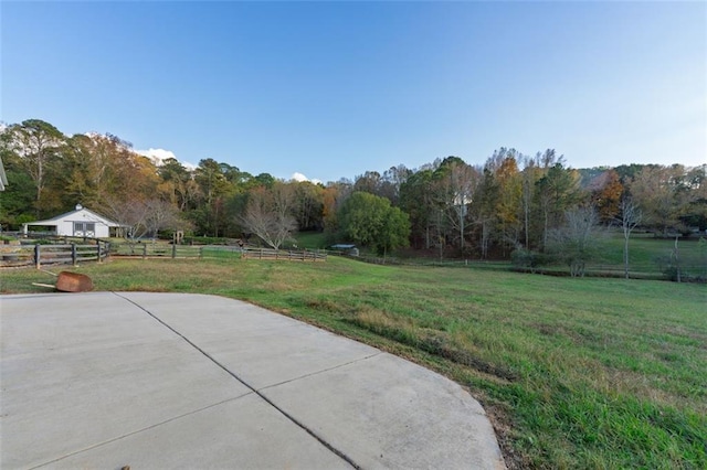 view of yard featuring a patio area and a rural view