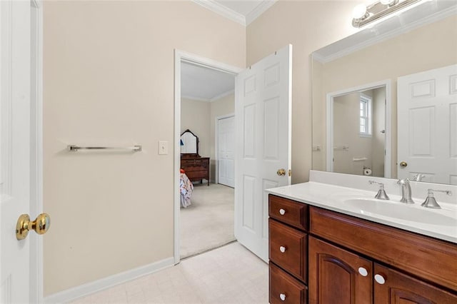 bathroom with toilet, vanity, and crown molding