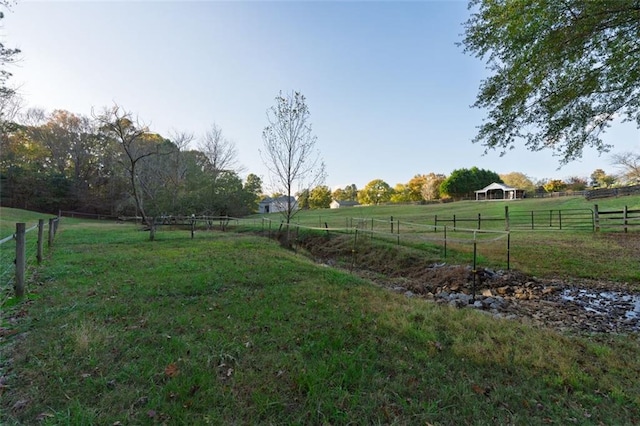 view of yard featuring a gazebo and a rural view