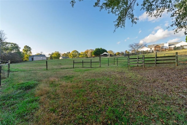 view of yard with a rural view