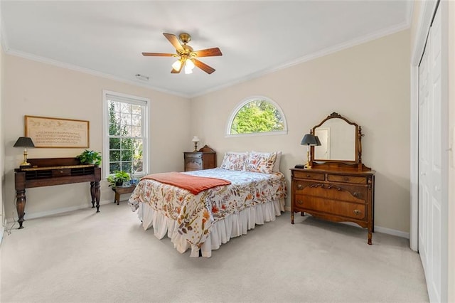 carpeted bedroom featuring ornamental molding, multiple windows, and ceiling fan