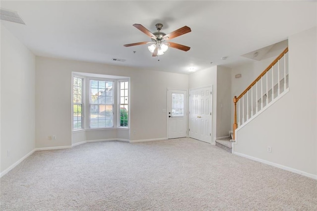 interior space with ceiling fan