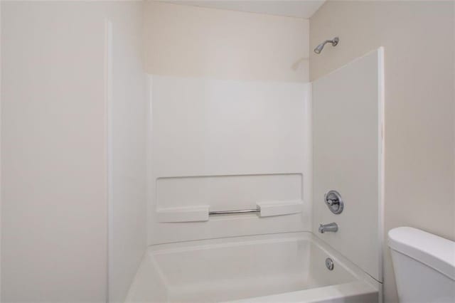 bathroom featuring toilet and shower / bathtub combination