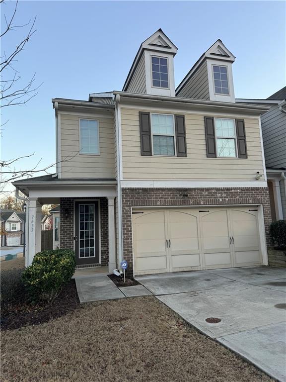 view of front of property with a garage