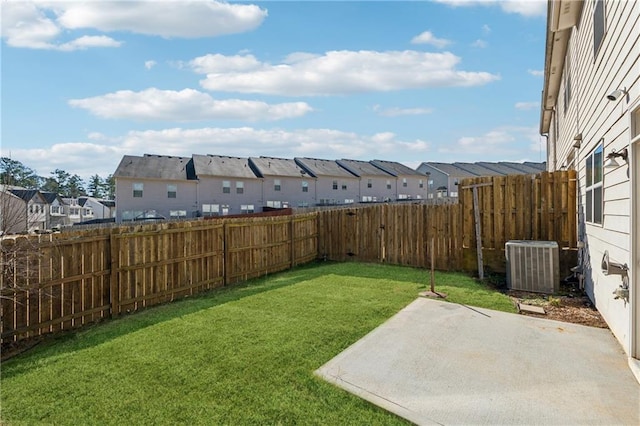 view of yard with a patio area and central air condition unit