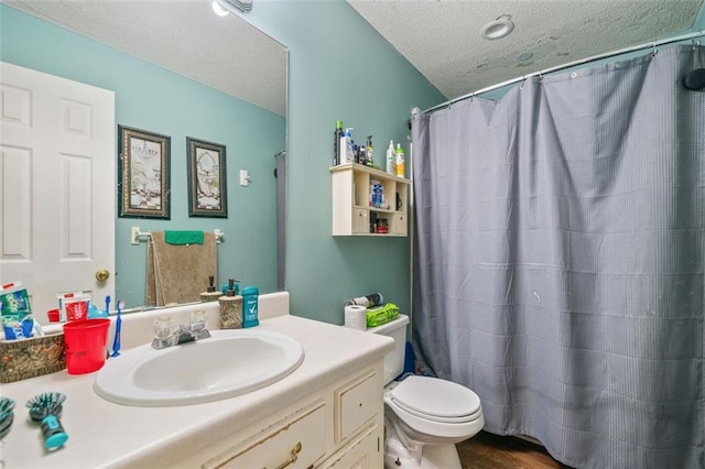 bathroom with toilet, a shower with curtain, a textured ceiling, vanity, and hardwood / wood-style floors