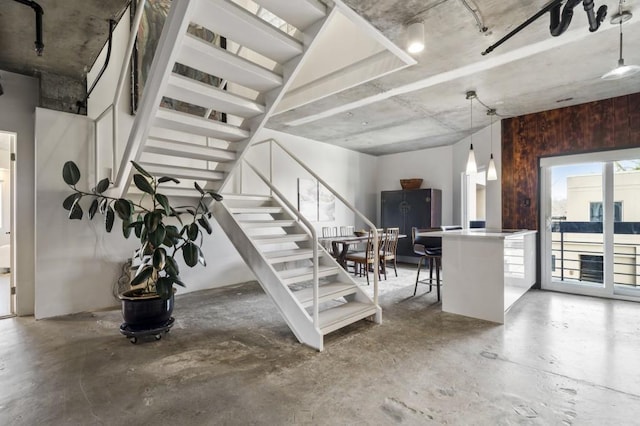 stairs with concrete floors