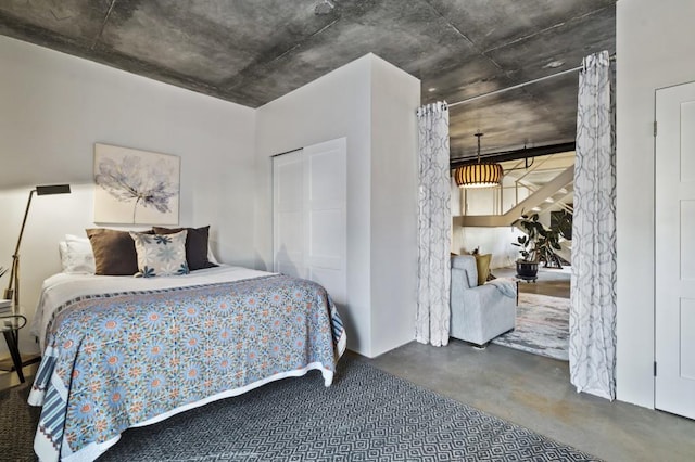 bedroom with concrete flooring