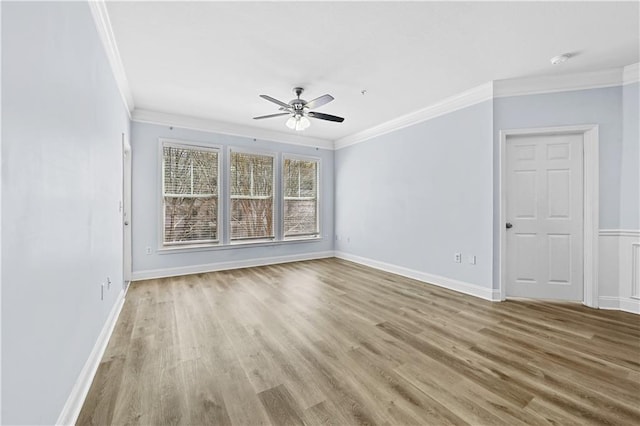 unfurnished room with ceiling fan, light wood-type flooring, and ornamental molding