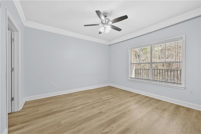 empty room featuring ceiling fan, light wood-type flooring, and ornamental molding