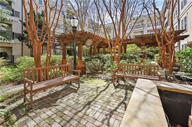 view of patio featuring a balcony and a pergola