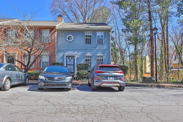 view of front of house featuring a chimney