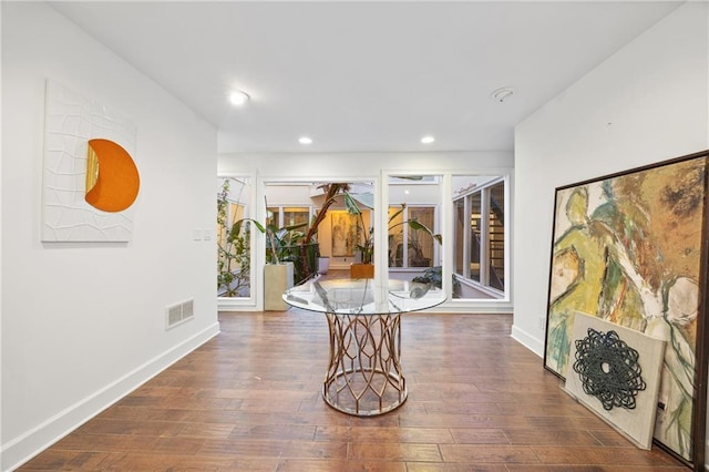 hallway with dark hardwood / wood-style floors