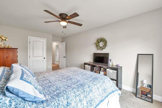bedroom featuring baseboards, carpet, and ceiling fan