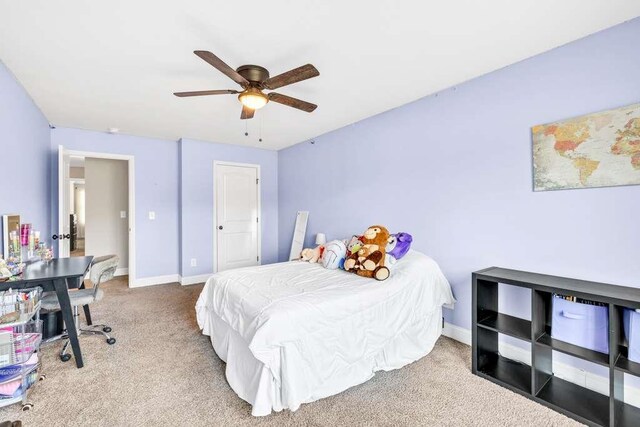bedroom with carpet, baseboards, and a ceiling fan