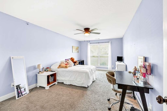 bedroom featuring carpet floors, an office area, baseboards, and ceiling fan