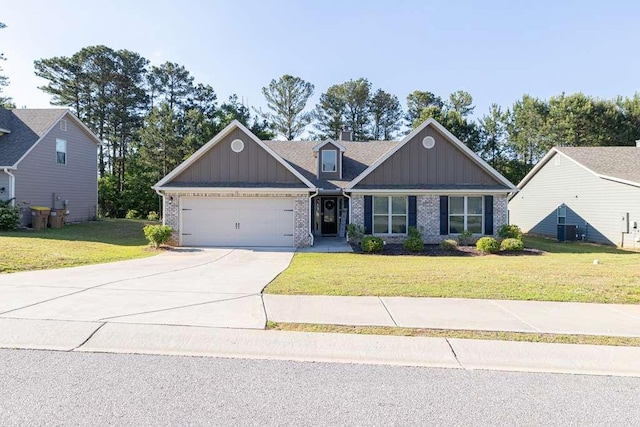 craftsman house featuring board and batten siding, an attached garage, concrete driveway, and a front yard
