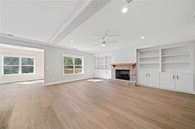 unfurnished living room with a brick fireplace, baseboards, light wood-style floors, and recessed lighting