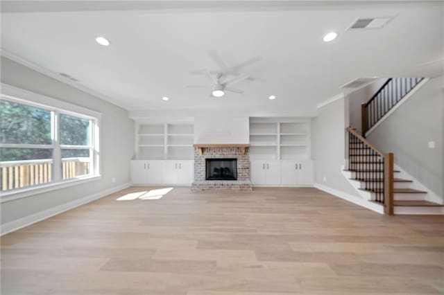 unfurnished living room featuring light wood-style floors, stairway, recessed lighting, and baseboards