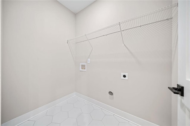 laundry area featuring light tile patterned floors, laundry area, washer hookup, baseboards, and electric dryer hookup