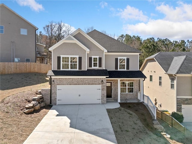 view of front of home featuring brick siding, a shingled roof, fence, a garage, and driveway