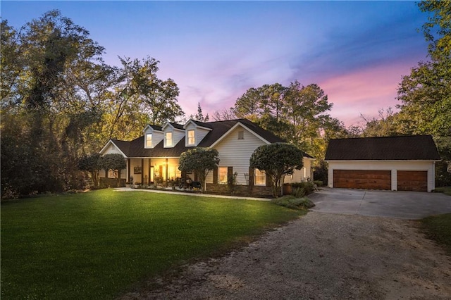 new england style home featuring a lawn