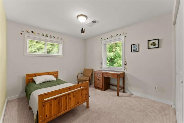 449 Clairemont Ave Unit H3, Decatur, GA 30030 - bedroom featuring multiple windows and light carpet