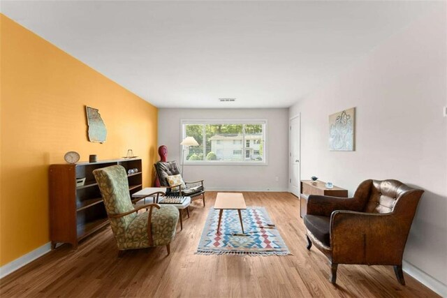 449 Clairemont Ave Unit H3, Decatur, GA 30030 - living area with wood finished floors and baseboards