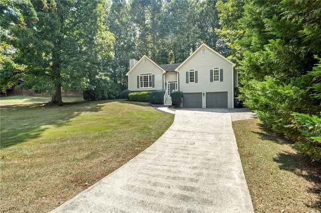 view of front of property featuring a garage and a front lawn