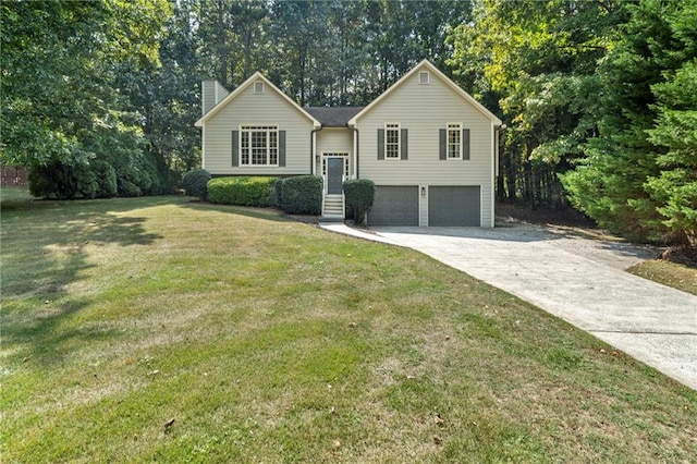 raised ranch with a front yard and a garage