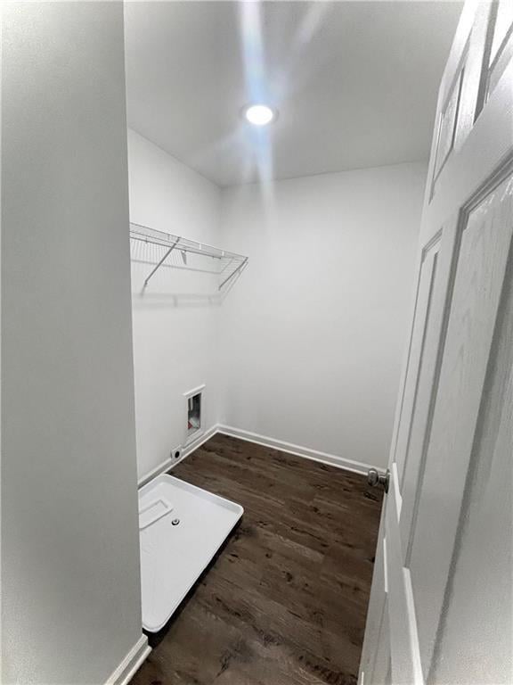 laundry area with hookup for a washing machine and dark hardwood / wood-style floors