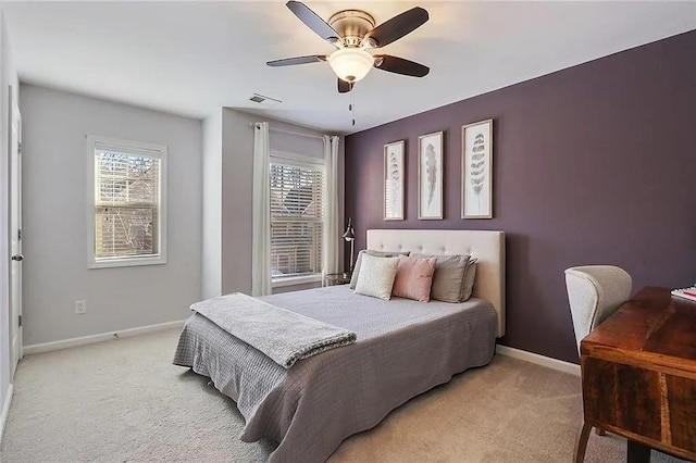 bedroom featuring ceiling fan and light colored carpet