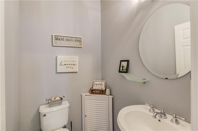 bathroom featuring sink and toilet