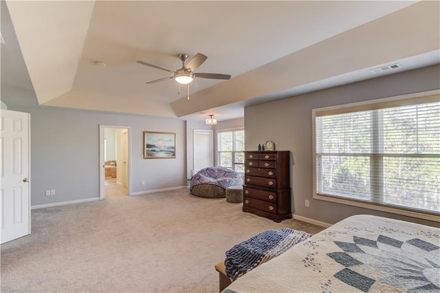 carpeted bedroom featuring ceiling fan and connected bathroom