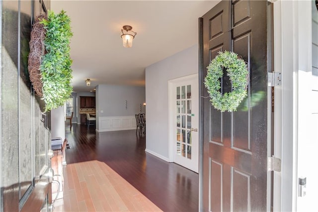 foyer featuring dark wood-type flooring