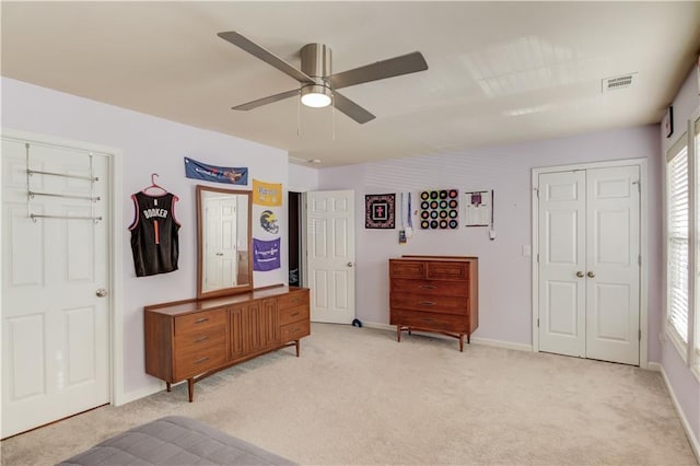 carpeted bedroom featuring ceiling fan